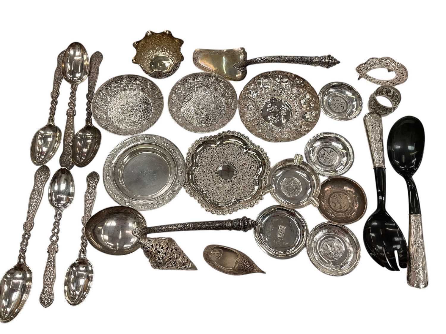 Lot 136 - Collection of Indian and Middle Eastern silver and white metal items to include pin dishes, ashtray, napkin rings and other items.