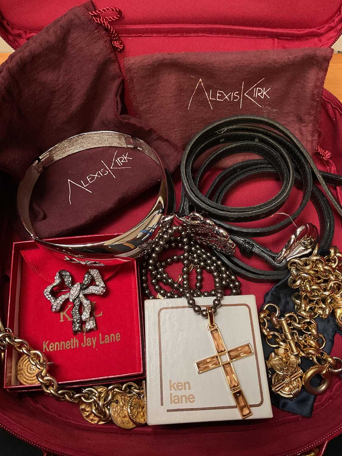 Lot 145 - Kenneth Lane paste set bow brooch in box, Alexis Kirk silvered articulated cuff choker necklace and two belts with dust bags, Agatha gilt metal necklace, bracelet and pair of matching earrings,...