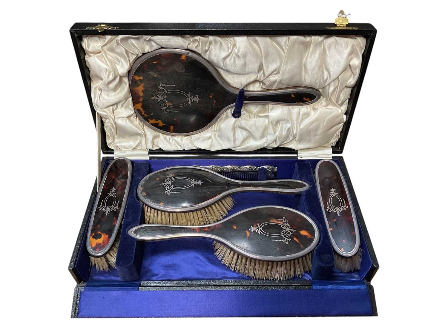 Lot 147 - 1920s silver and tortoiseshell five piece dressing table set in fitted case