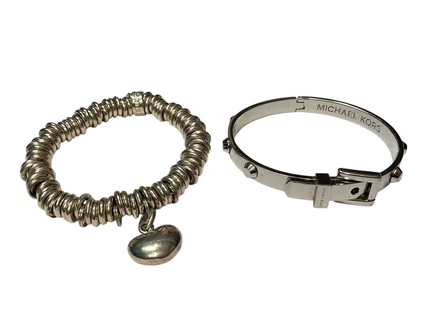 Lot 148 - Links of London 'Sweetie' charm bracelet with a silver heart charm and a Michael Kors 'Astor' buckle bangle (2)