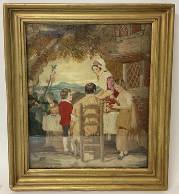 Lot 1139 - Georgian woolwork picture after George Morland of family sitting at a table outside cottage