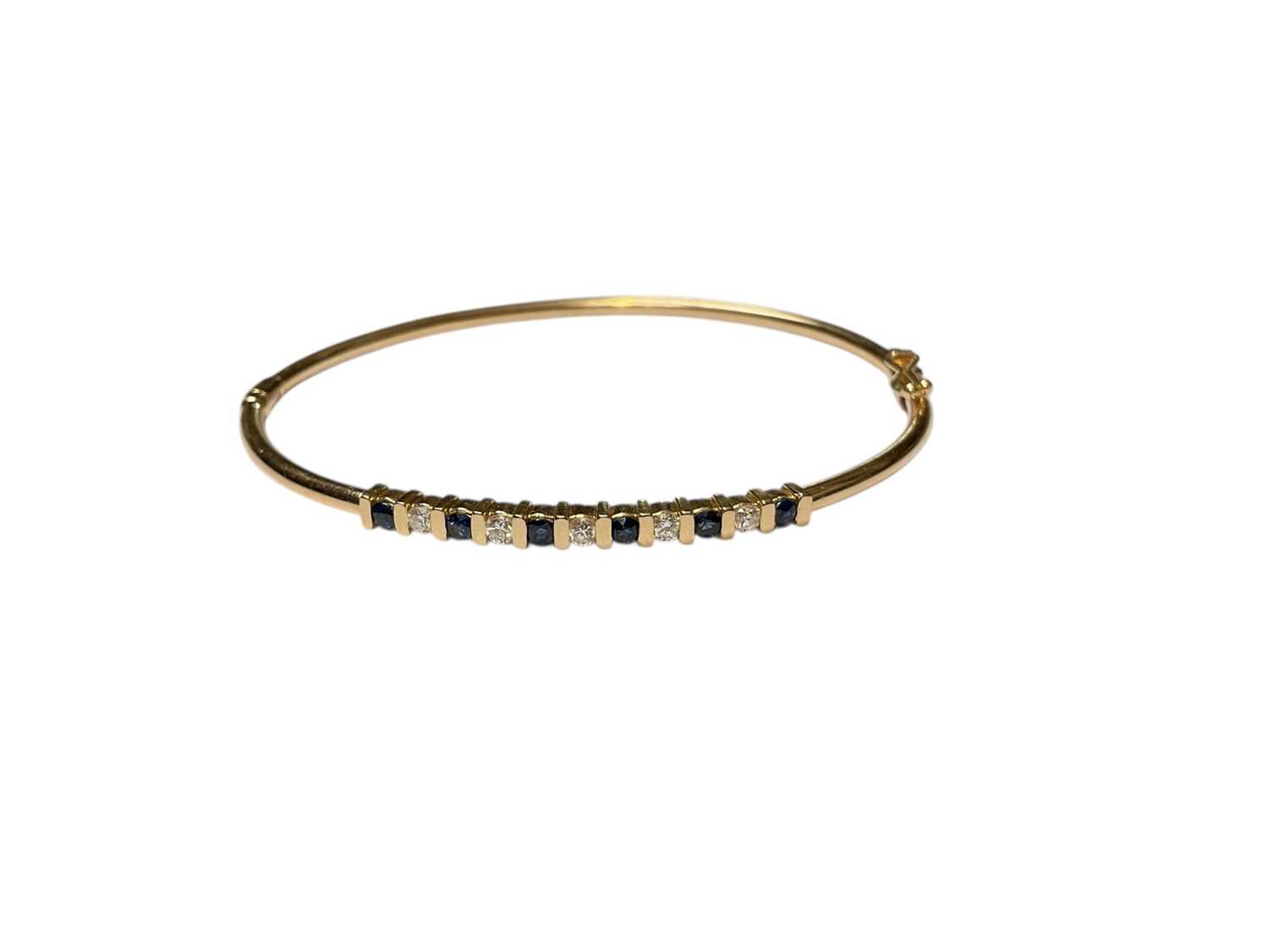 Lot 157 - Sapphire and diamond hinged bangle (stamped 14K)