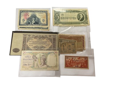 Lot 493 - World - Mixed banknotes to include French New Calendonia 'Noumea' blue 5 Francs undated issue c. 1944 x 2 GF, French Indo-China 20 Piastre undated issue c. 1936-1939 GF-AVF, Russia 10,000 Ruble...