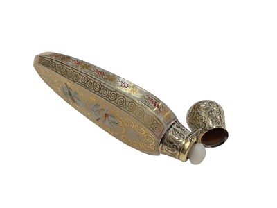 Lot 194 - Good quality 19th century Continental opalescent glass scent bottle with gilded decoration and gilded white metal mount with engraved decoration, 13cm in overall length.