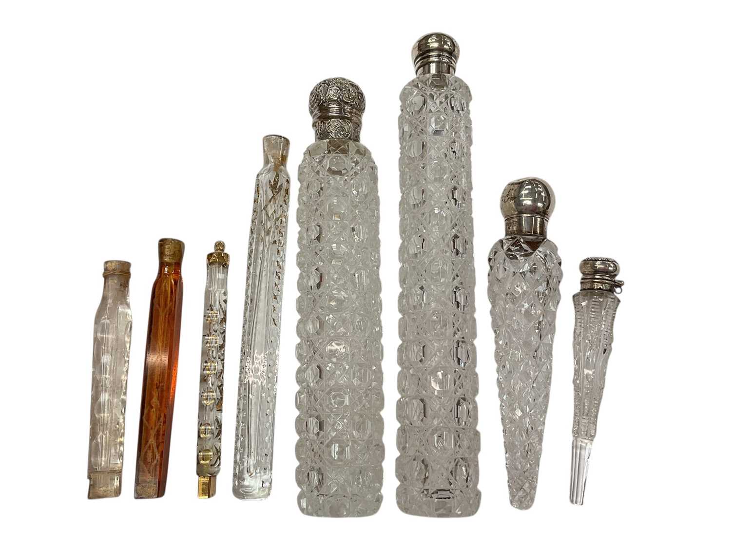 Lot 195 - Four Victorian and later cut glass scent bottles with silver mounts (various dates and makers), together with four continental glass scent bottles (8).