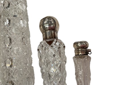Lot 195 - Four Victorian and later cut glass scent bottles with silver mounts (various dates and makers), together with four continental glass scent bottles (8).