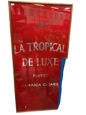 Lot 2502 - Large and impressive La Tropical De Luxe Finest Jamaica Cigars reverse glass shop display / advertising sign in wooden frame, 179 x 87cm