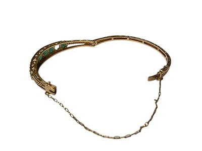 Lot 205 - 9ct gold emerald and diamond hinged bangle (one stone missing)