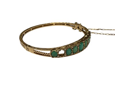 Lot 205 - 9ct gold emerald and diamond hinged bangle (one stone missing)