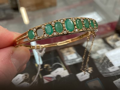 Lot 205 - 9ct gold emerald and diamond hinged bangle (one stone missing)