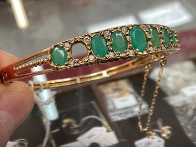 Lot 205 - 9ct gold emerald and diamond hinged bangle (one stone missing)