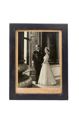 Lot 47 - H.M. Queen Elizabeth II and H.R.H. The Duke of Edinburgh, signed presentation portrait photograph of the Royal couple taken at Buckingham Palace, signed in ink ' Philip 1958 Elizabeth R' in origin...