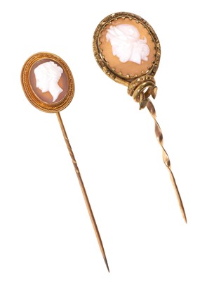 Lot 730 - Two antique carved shell cameo stick pins