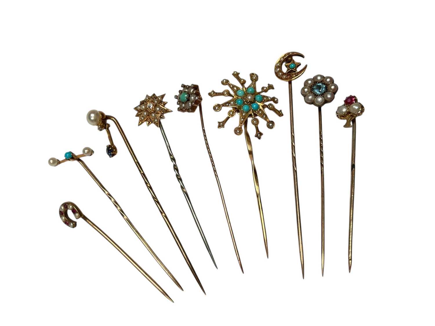 Lot 230 - Collection of nine Victorian and Edwardian gold and yellow metal seed pearl and gem set stick pins