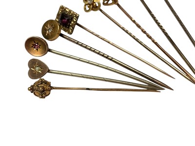 Lot 231 - Collection of nine Victorian and Edwardian gold and yellow metal gem set stick pins