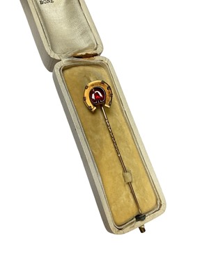 Lot 233 - Collection of antique and later stick pins including a diamond set red stone panel horseshoe, banded agate cabochon, paste set etc and a collection of various semi-precious stone sphere stick pi...