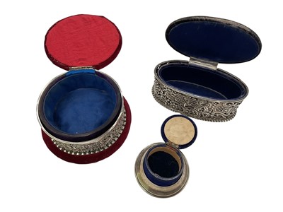 Lot 234 - Two Victorian silver mounted pin cushion jewellery boxes both with embossed scroll decoration, together with a smaller 1920s silver mounted pin cushion trinket box