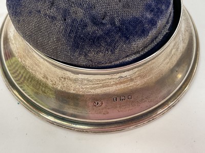 Lot 234 - Two Victorian silver mounted pin cushion jewellery boxes both with embossed scroll decoration, together with a smaller 1920s silver mounted pin cushion trinket box