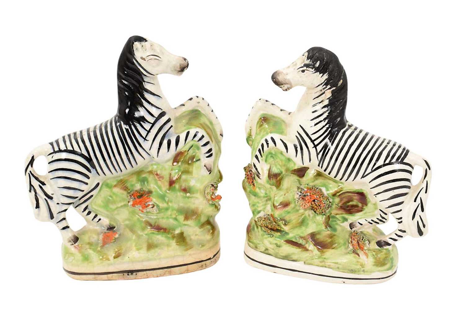 Lot 55 - Pair of Staffordshire pottery models of zebra, circa 1850