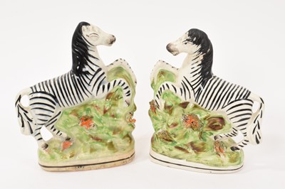 Lot 284 - Pair of Staffordshire pottery models of zebra, circa 1850