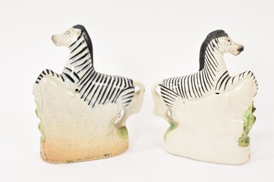 Lot 55 - Pair of Staffordshire pottery models of zebra, circa 1850