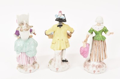 Lot 80 - Set of three Continental porcelain figures of street vendors, circa 1900