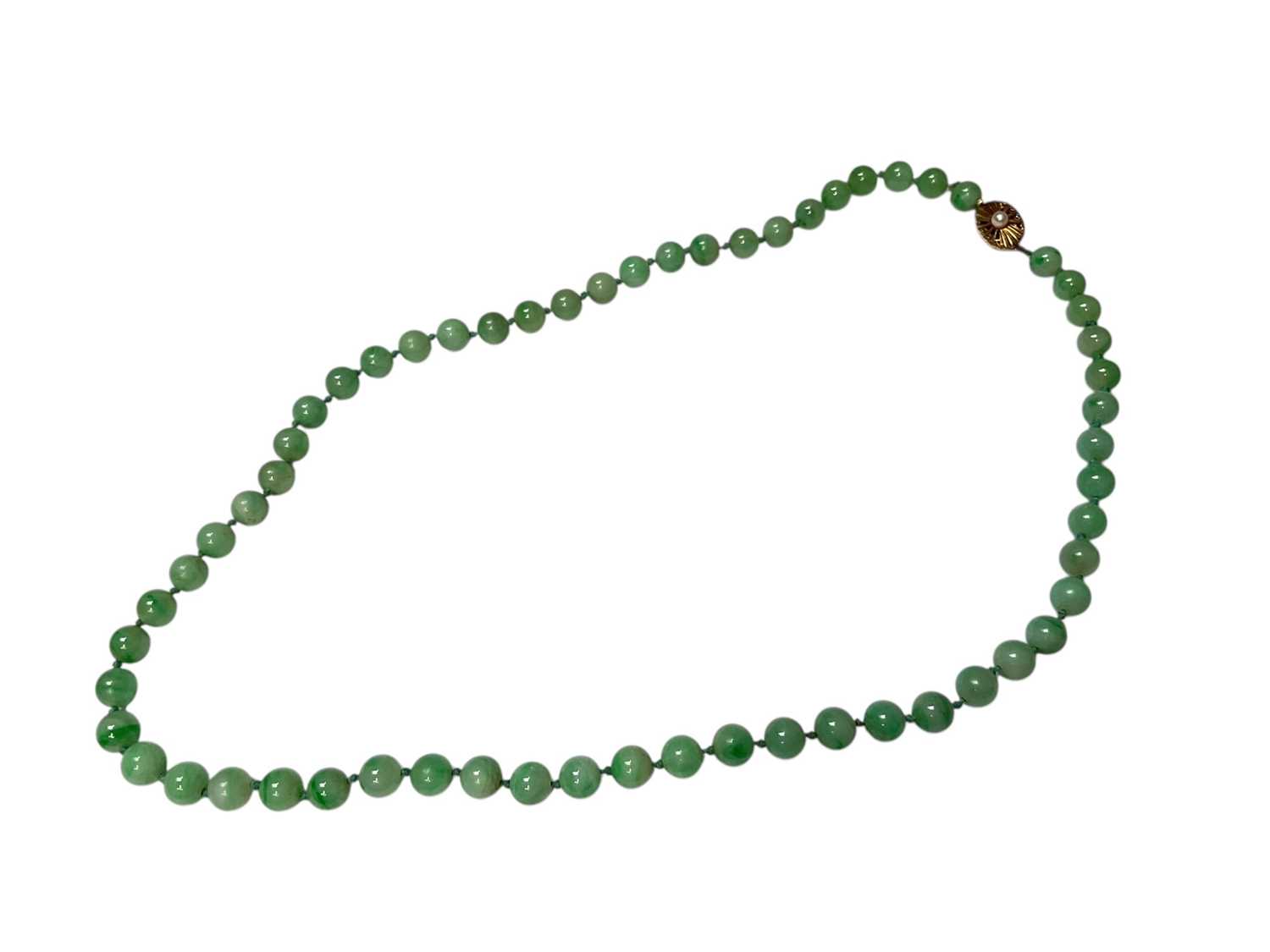 Lot 238 - Jade/ green hardstone polished spherical bead necklace with an oval 9ct gold clasp set with a single pearl, 54cm long