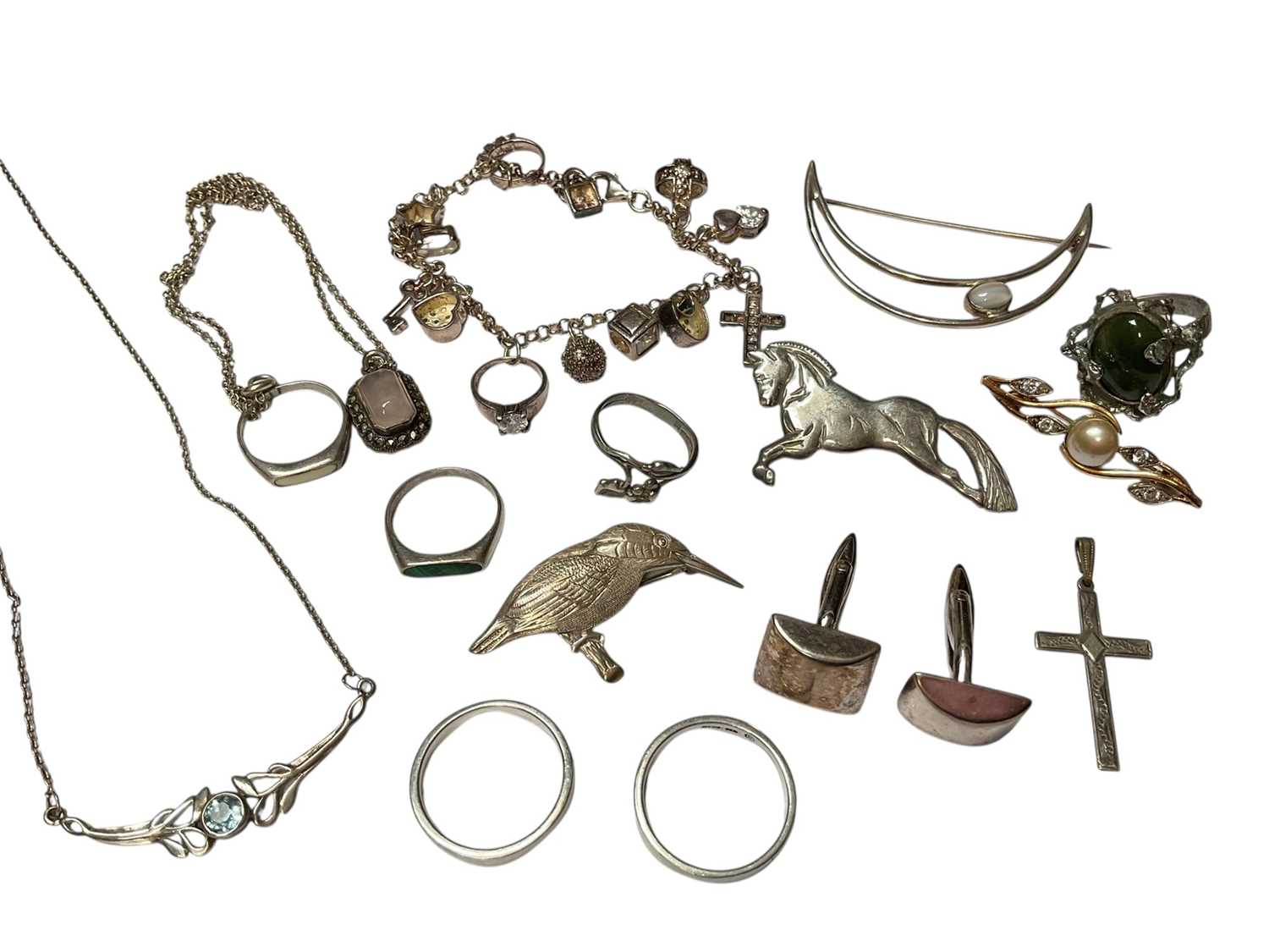 Lot 239 - Group of silver and white metal jewellery to include rings, pair of cufflinks, brooches, pendant necklaces and a contemporary charm bracelet