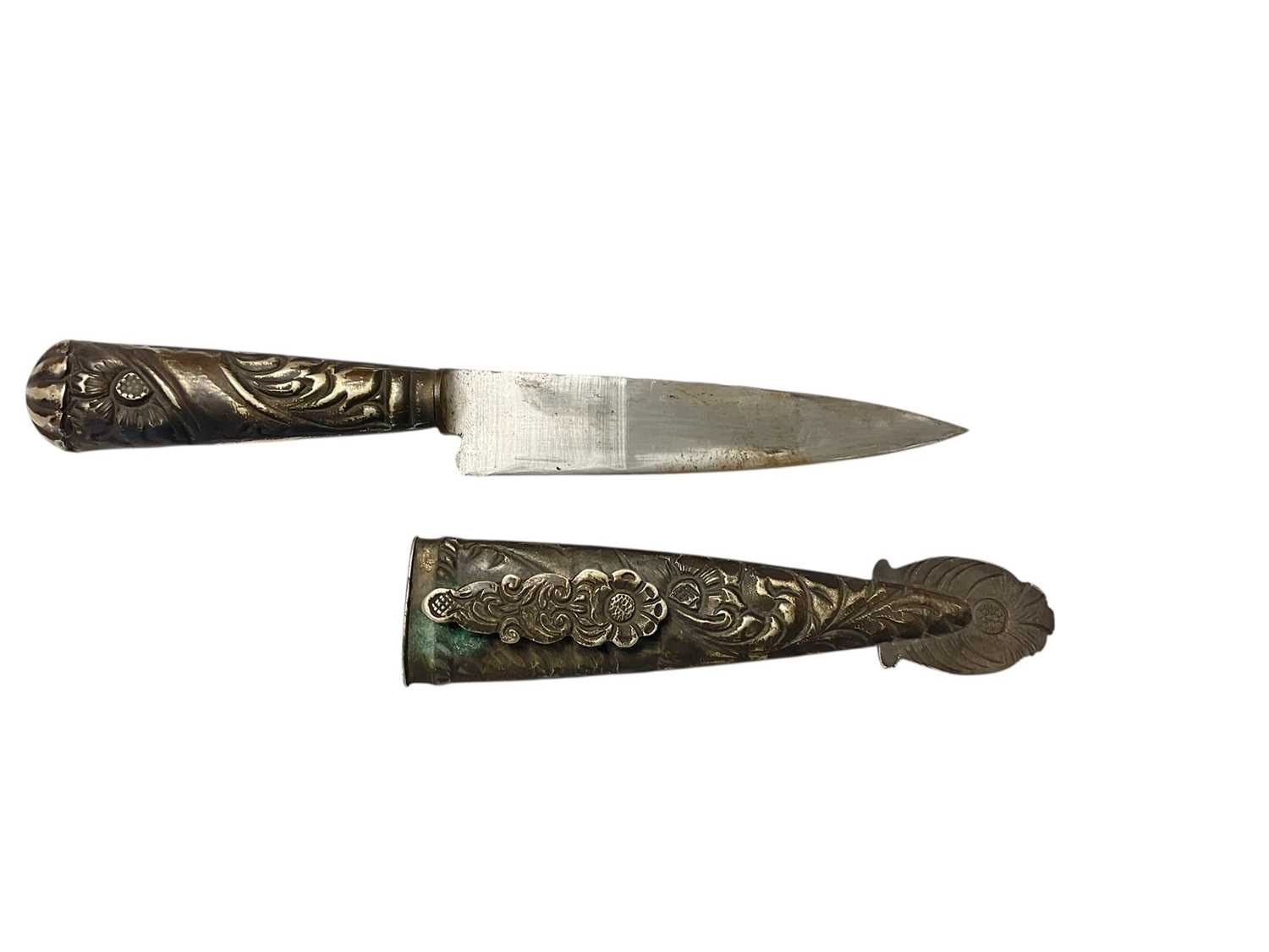 Lot 744 - South American Gaucho Knife / Dagger, steel blade by Pampa, in white metal scabbard with ornate scroll decoration , 29cm overall length.