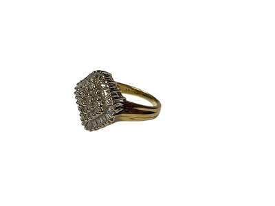 Lot 250 - Diamond cluster ring with a central cluster of brilliant cut diamonds surrounded by a border of baguette cut diamonds in claw setting...