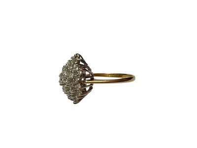 Lot 251 - Diamond flower shape cluster ring with thirty-seven brilliant cut diamonds in a claw setting on 18ct gold shank (London 1982). Ring si...