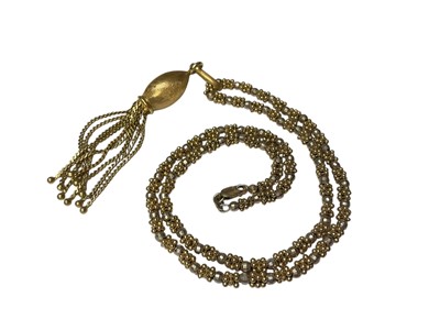 Lot 256 - 18ct gold tassel pendant, 7.5cm long, on 18ct yellow and white gold bead chain with 9ct gold clasp, 43cm long