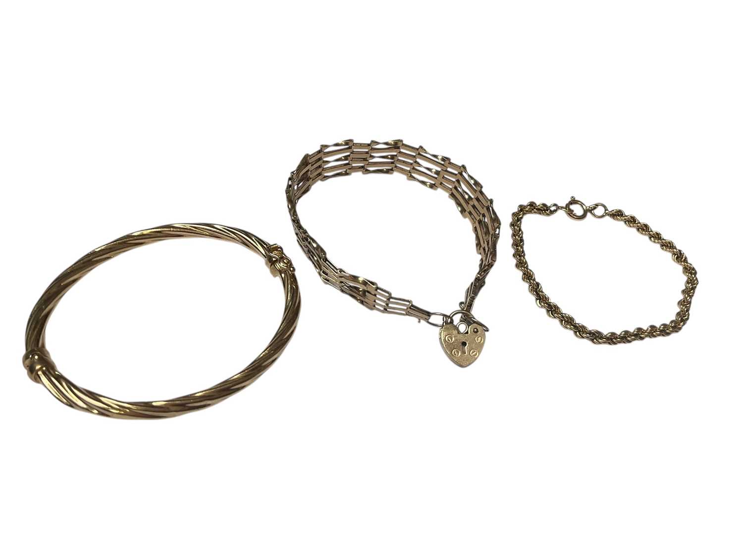 Lot 259 - 9ct gold gate bracelet with padlock clasp, 9ct gold rope twist bracelet and 9ct gold bangle