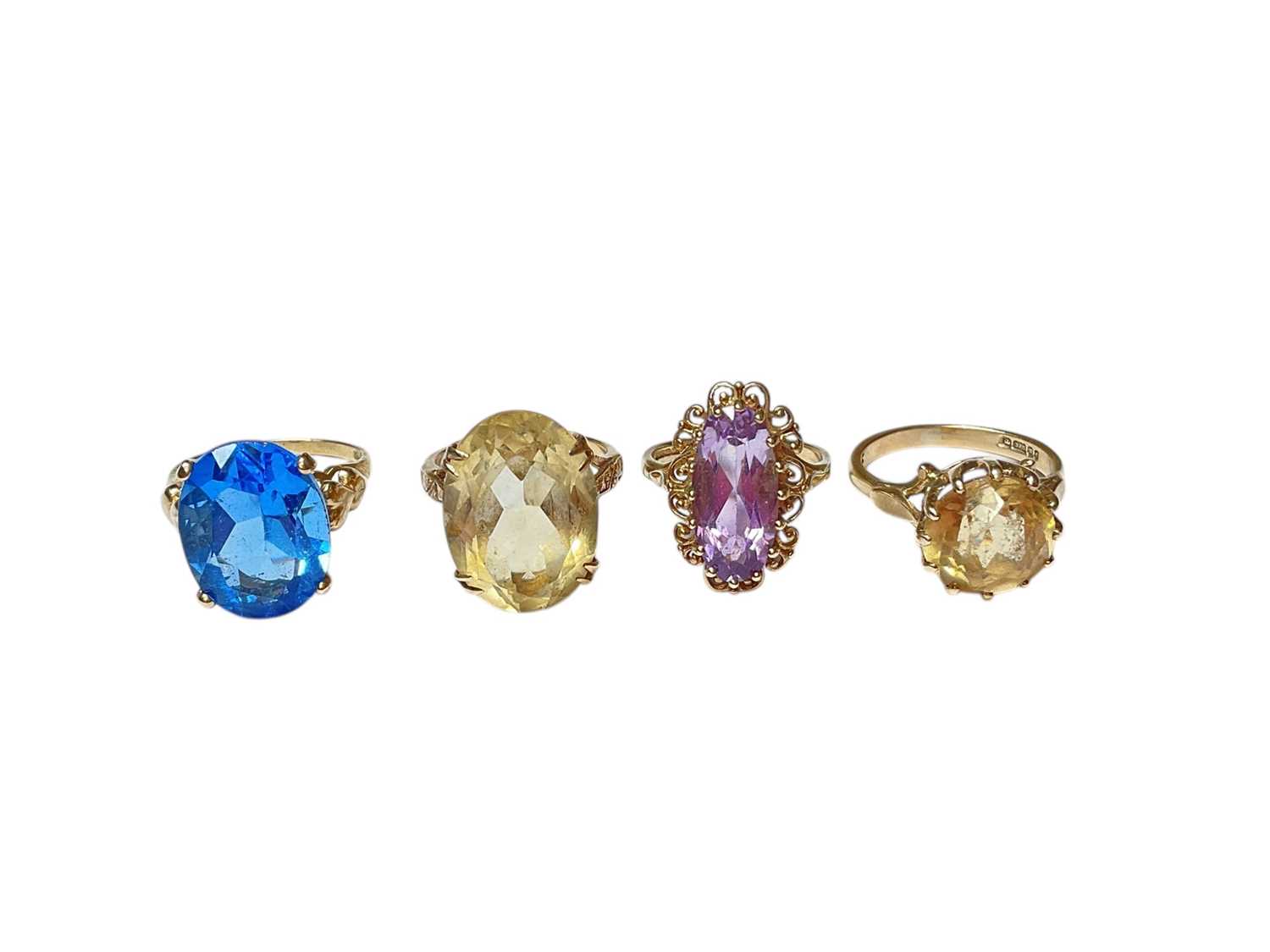 A Single Cocktail Rings Lot 261 - Four 9ct gold single stone gem set cocktail