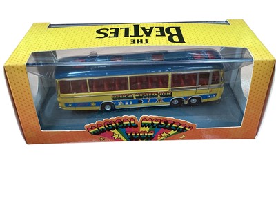 Lot 2040 - Beatles memorabilia including boxed Corgi yellow submarine, 4 boxed Beatles Titan Vinyl figures, boxed Blue Meany and Hornby Magical Mystery tour bus