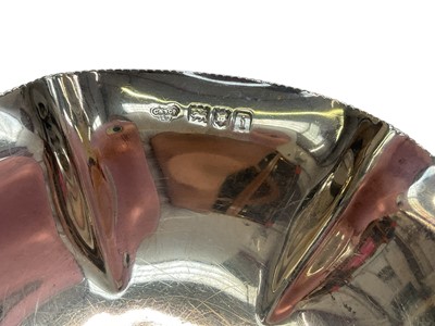 Lot 267 - Edwardian silver bonbon dish, (London 1904), maker Goldsmiths & Silversmiths Company, 11.5cm in diameter, together with George V silver pin dish (Birmingham 1929), maker Asprey & Co Ltd,...