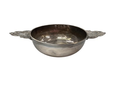 Lot 270 - 19th century French silver porringer of circular form with twin handles, marked with Minervas head mark, 23cm in diameter (including handles), all at 9.5ozs.