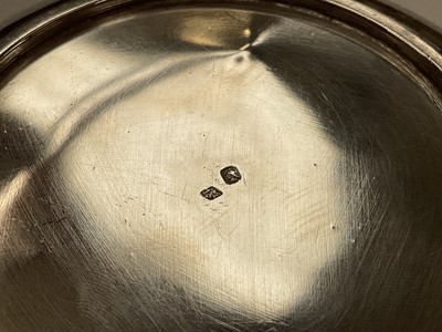 Lot 270 - 19th century French silver porringer of circular form with twin handles, marked with Minervas head mark, 23cm in diameter (including handles), all at 9.5ozs.