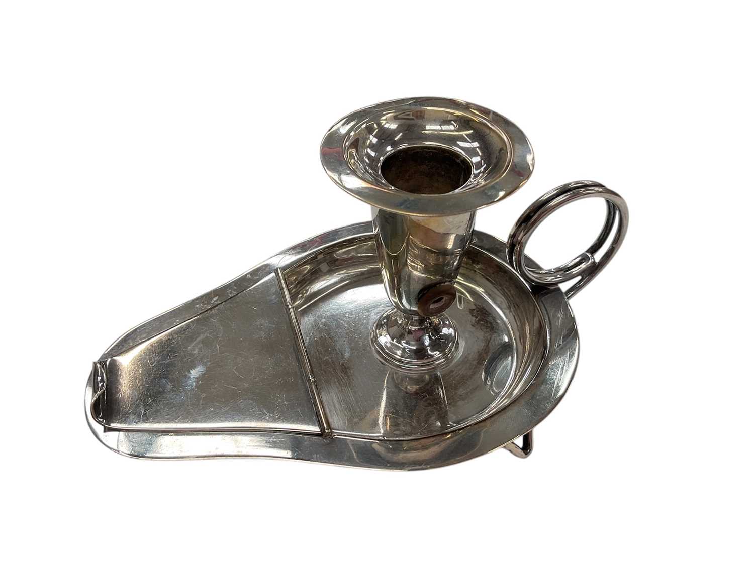 Lot 273 - Unusual late Victorian silver chamberstick with hinged compartment opening to reveal a match striker, (London 1899), maker WCJL, 16.7cm in length, all at approximately 8ozs