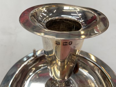 Lot 273 - Unusual late Victorian silver chamberstick with hinged compartment opening to reveal a match striker, (London 1899), maker WCJL, 16.7cm in length, all at approximately 8ozs