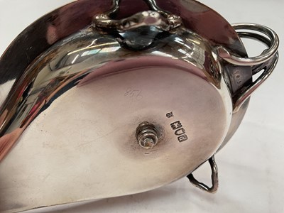 Lot 273 - Unusual late Victorian silver chamberstick with hinged compartment opening to reveal a match striker, (London 1899), maker WCJL, 16.7cm in length, all at approximately 8ozs