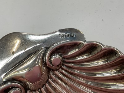 Lot 274 - Victorian silver sauce boat, together with a shell butter dish and another silver dish, (various dates and makers), all at approximately 8.5ozs