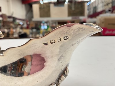 Lot 274 - Victorian silver sauce boat, together with a shell butter dish and another silver dish, (various dates and makers), all at approximately 8.5ozs