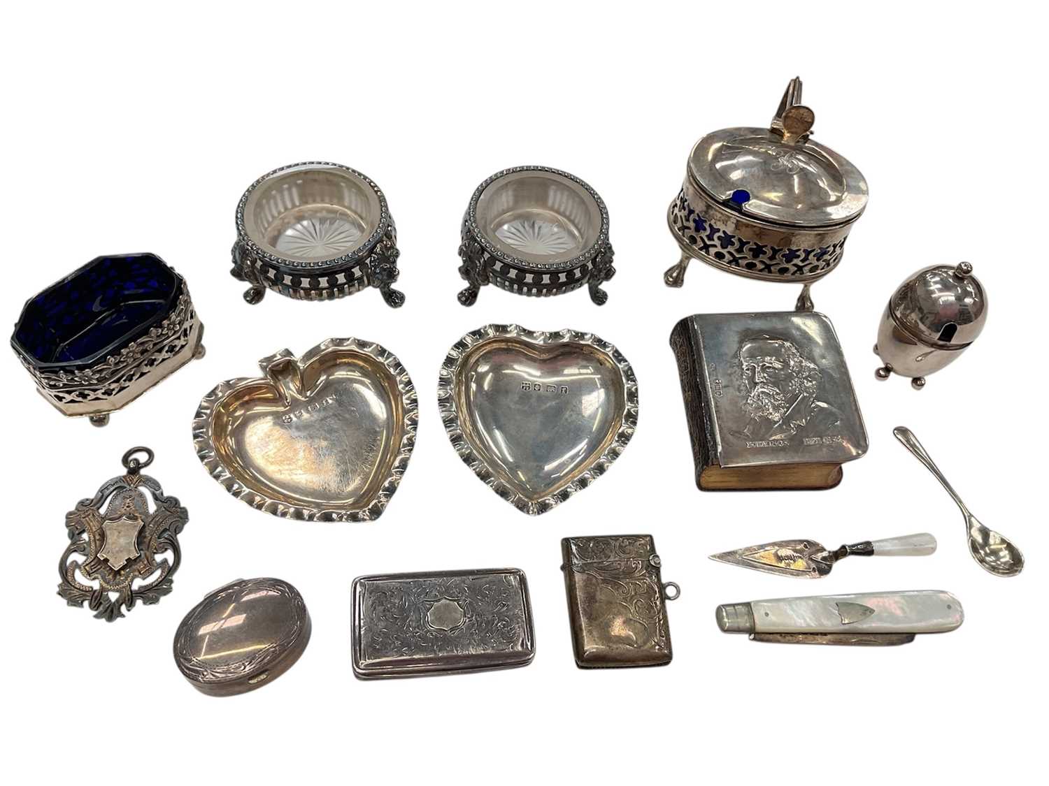Lot 275 - Group of assorted silver items to include an early Victorian silver snuff box, (Birmingham 1838), two silver mustard pots, trowel book mark and other items (various dates and makers), approximat...