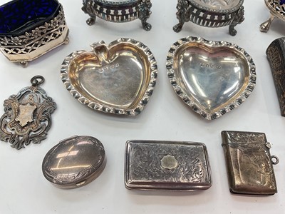 Lot 275 - Group of assorted silver items to include an early Victorian silver snuff box, (Birmingham 1838), two silver mustard pots, trowel book mark and other items (various dates and makers), approximat...