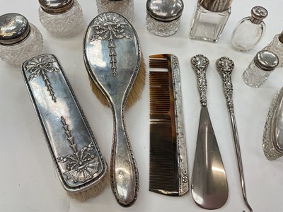 Lot 276 - Group of nine silver topped / mounted cut glass vanity jars and scent bottles, together with silver button hook, shoe horn, comb and two brushes (various dates and makers).