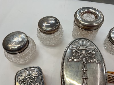 Lot 276 - Group of nine silver topped / mounted cut glass vanity jars and scent bottles, together with silver button hook, shoe horn, comb and two brushes (various dates and makers).