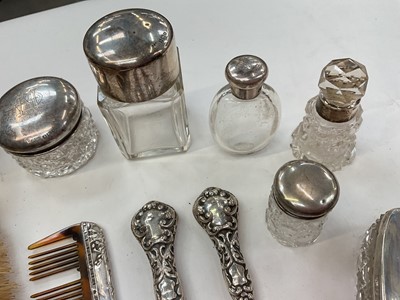 Lot 276 - Group of nine silver topped / mounted cut glass vanity jars and scent bottles, together with silver button hook, shoe horn, comb and two brushes (various dates and makers).