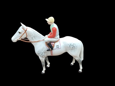 Lot 1112 - Beswick figure of a jockey on a grey horse, 20cm high