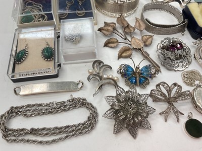 Lot 281 - Group of silver and white metal jewellery including bangles, two Scottish brooches, other brooches, locket pendant on chain, semi-precious gem stone jewellery etc
